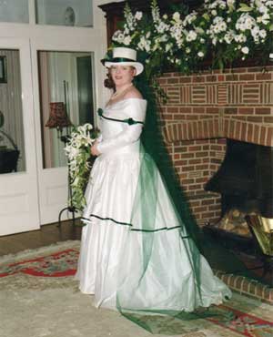 One of the Dunn daughters on her wedding day in front of the famous fireplace with inscription